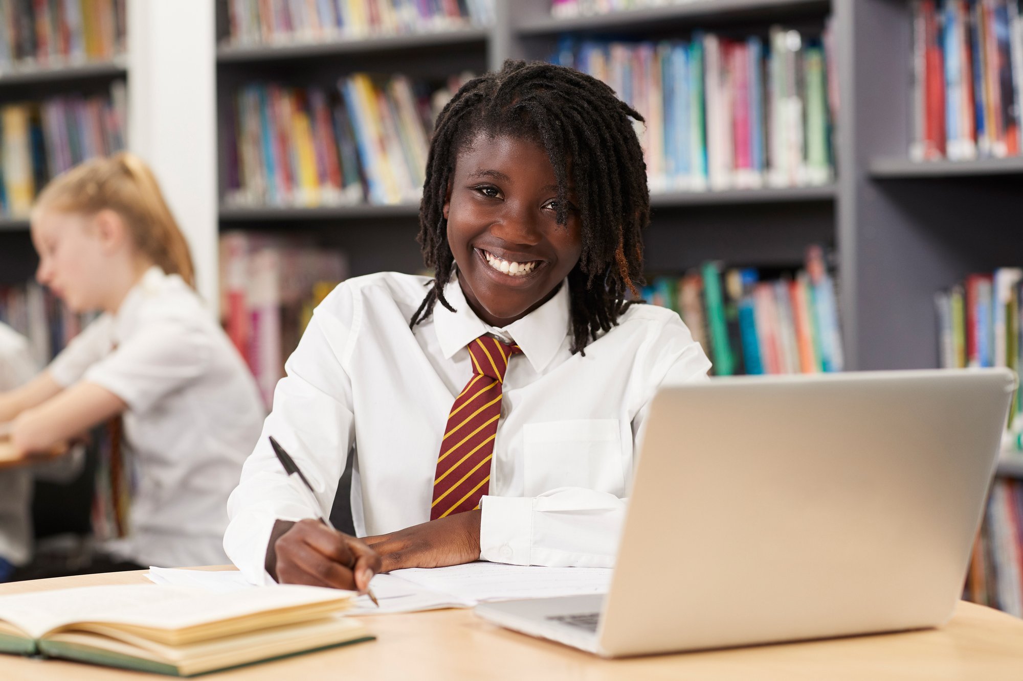 Smiling student with laptop